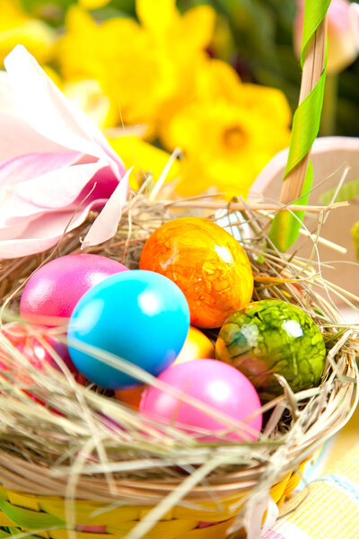 close-up view of decorative easter basket with colorful painted eggs   