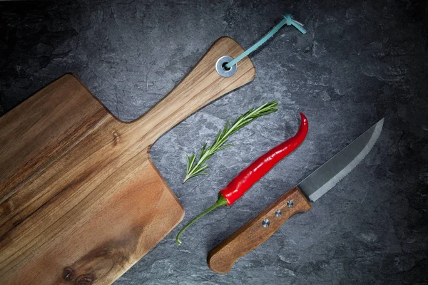 Red Hot Chilli Pepper Rosemary Knife Wooden Board Grey Table — Stock Photo, Image