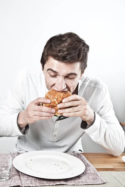 Handsome Young Man Eating Delicious Sandwich Meat Vegetables — Stock Photo, Image