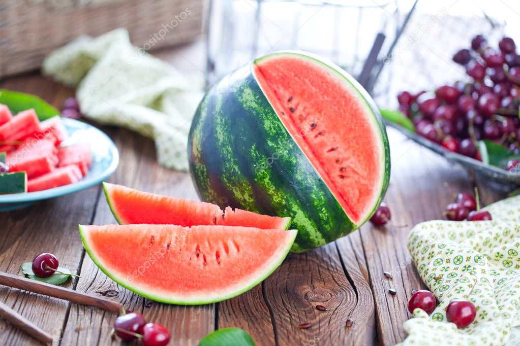 Fresh ripe watermelon on wooden background