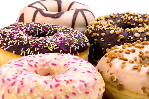 Vista Cerca Varias Rosquillas Deliciosas Sobre Fondo Blanco — Foto de Stock