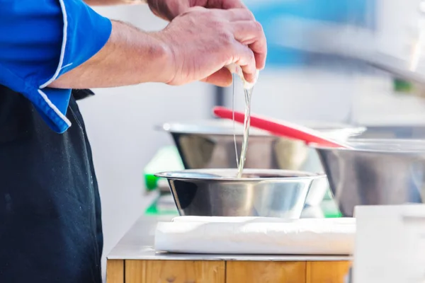 Chefs at work in a restaurant kitchen making delicious food