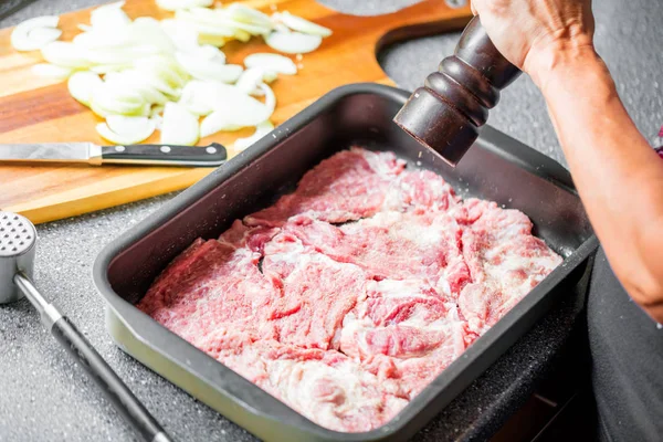 Cropped shot of person salting delicious uncooked meat in baking tray — Stock Image Cropped Shot Person Salting Delicious Uncooked Meat Baking Tray Stock Photo