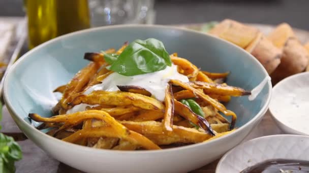 Cropped Shot Woman Holding Bowl Baked Sweet Potatoes Sauce Basil — Stock Video