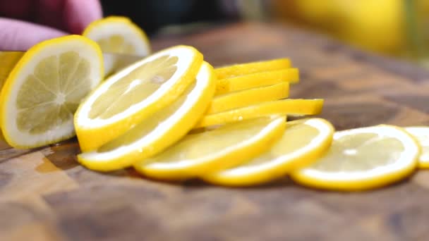 Close Partial View Person Holding Knife Slicing Fresh Ripe Lemon — Stock Video