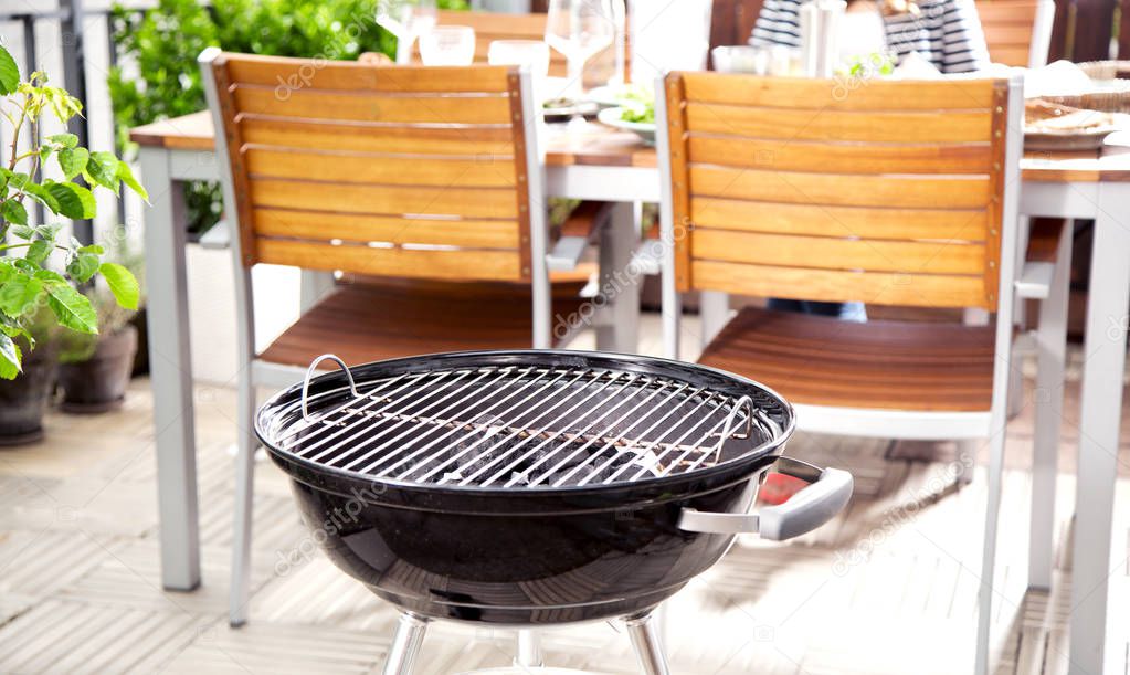 close-up of charcoal grill at barbecue place in backyard