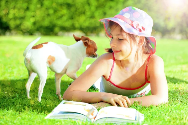 Adorable Smiling Child Lying Grass Book Looking Cute Dog — Stock Photo, Image