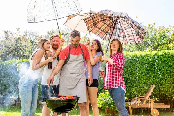 Diverse People Friends Hanging Out Together Outdoors and Cooking Barbeque in Backyard