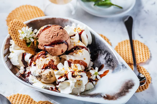 Chocolate ice cream in a bowl in cafe on the table, close-up view