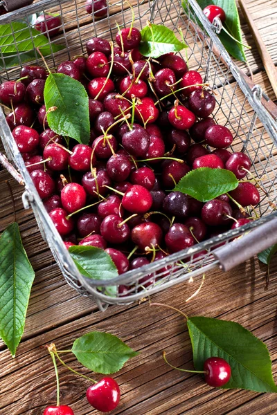Sweet fresh ripe cherries in basket, close-up view