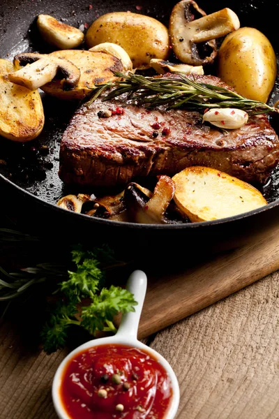 Delicious Grilled Steak Sirloin Potatoes Mushrooms Frying Pan Sauce Wooden — Stock Photo, Image