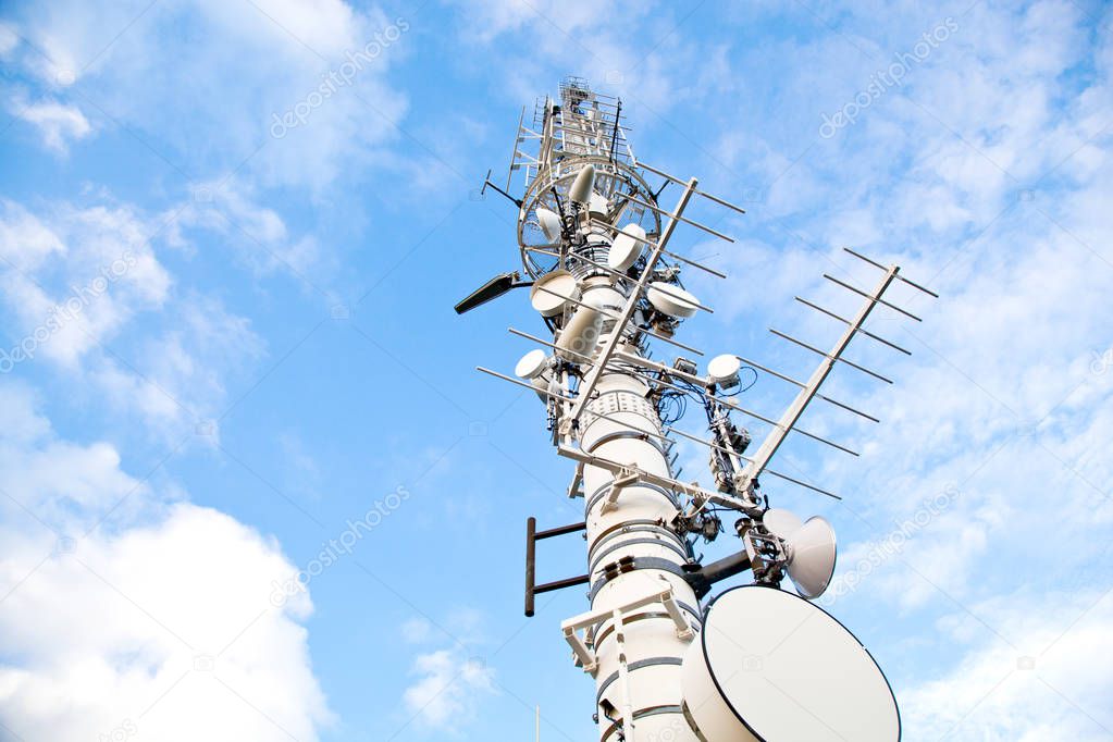 low angle view of high voltage tower with blue sky