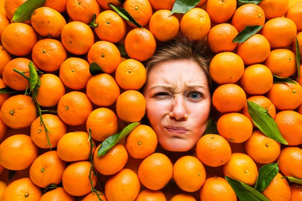 Food industry. Face of laughing young woman in orange plane.