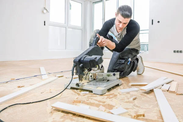 Concentrated Man Installing Oak Parquet Floor Home Improvement — Stockfoto