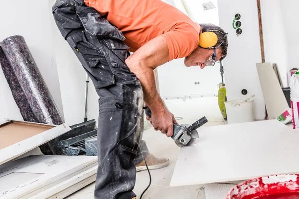 Man Cutting Ceramic Tiles Handy Machine Construction Site Indoors — Stock Photo, Image