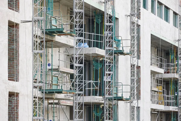 Building facade under construction. Concrete structure. Architecture. Horizontal