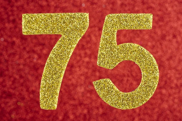 Number seventy-five golden color over a red background. Anniversary. Birthday