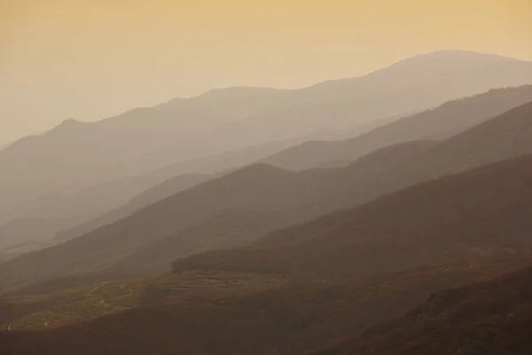 Stock image Mountains silhouette at dusk. Jerte valley in warm tone. Spain