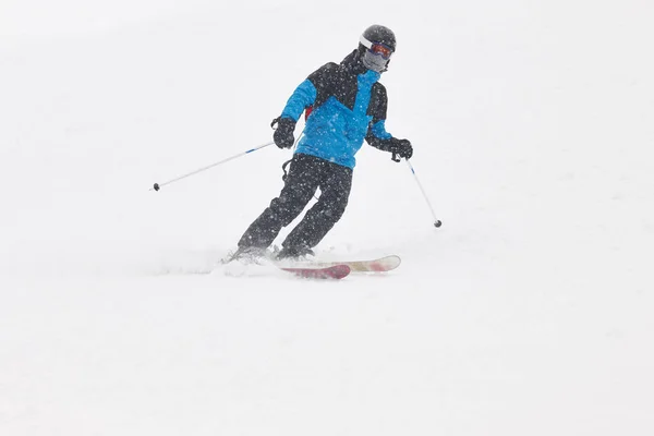 Skiing under the snow. Winter sport. Ski slope. Horizontal