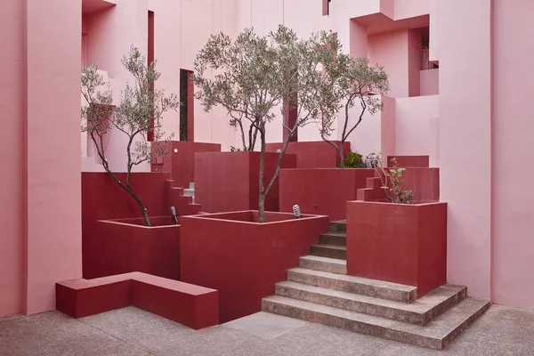 Geometric building design. The red wall, La manzanera. Calpe, Spain