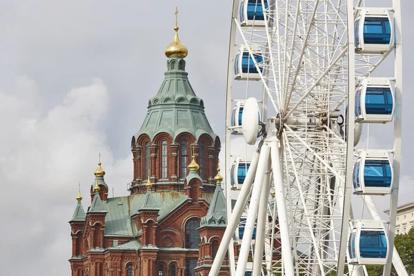 Helsinki skyline city center. Big wheel and Uspenki cathedral