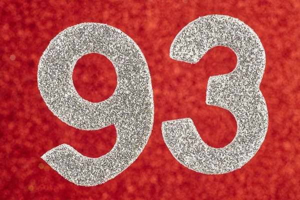 Number ninety-three silver color over a red background. Annivers — Stock Photo, Image