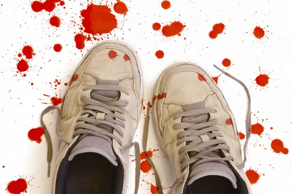 Violence against children. Used bloodstained sneakers — Stock Photo, Image