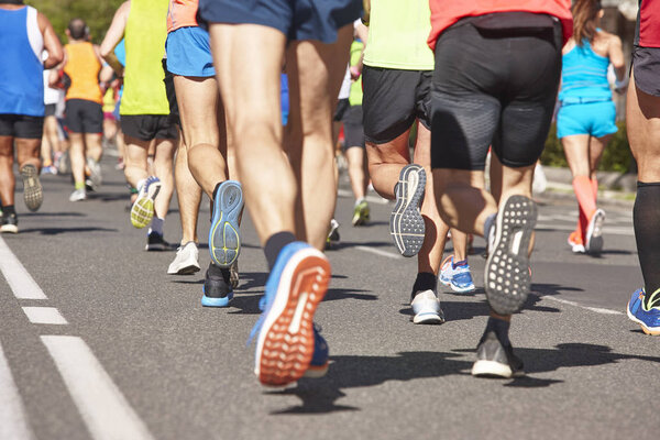 Marathon runners on the street. Healthy lifestyle. Athletes effo