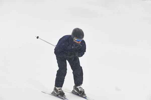 Skiing on a snowy hill slope landscape. Winter sport Stock Image