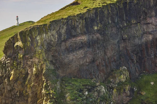 Mykines lighthouse and cliffs on Faroe islands. Hiking landmark — Stock Photo, Image