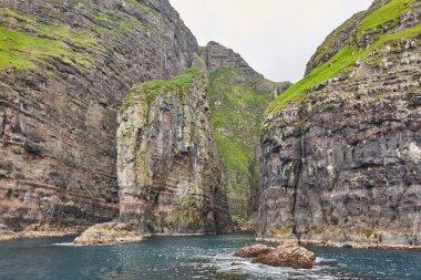 Vestmanna stunning bird cliffs and atlantic ocean, the elephant. Faroe islands.  clipart