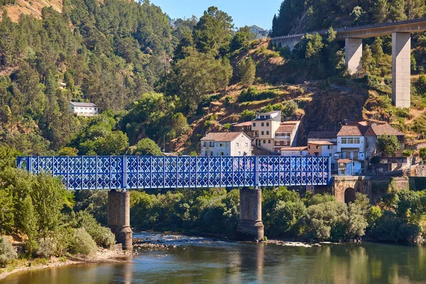 Blue metalic train bridge. Os Peares, Ribeira sacra. Spain