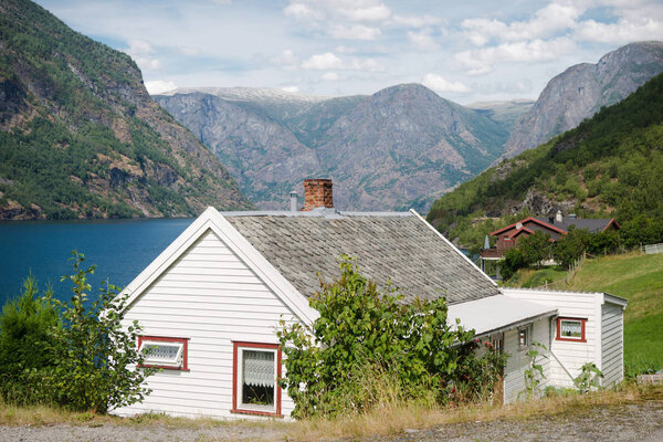 beautiful wooden houses in Flam village at majestic Aurlandsfjord (Aurlandsfjorden), Norway