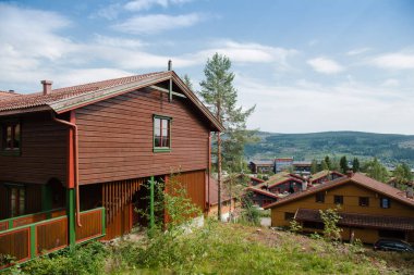 TRYSIL, NORWAY - 26 JULY 2018: living houses at largest ski resort Trysil in Norway clipart