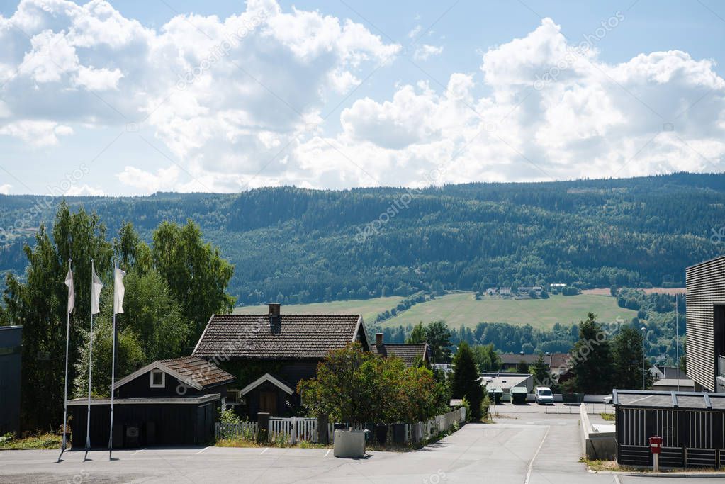 living houses with mountains behind in Lillehammer, Oppland, Norway