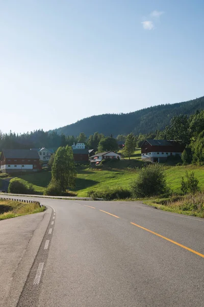 Road leading through village with living houses in Trysil, Norway's largest ski resort — Stock Photo