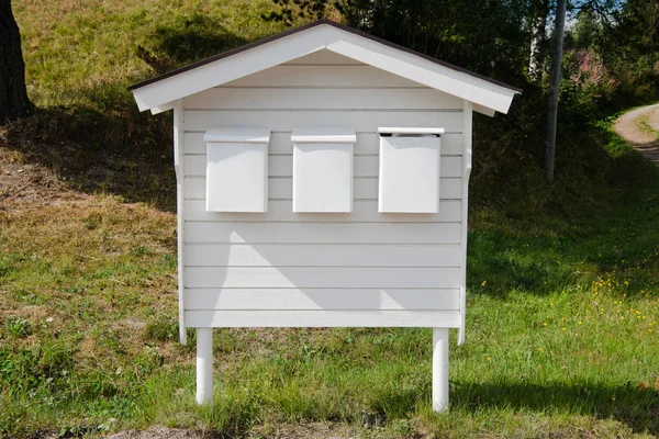 Three white post boxes placed in row in Trysil, Norway's largest ski resort — Stock Photo