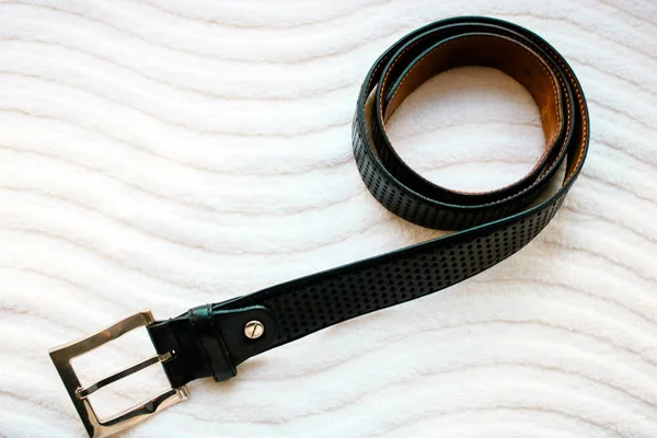 Men\'s leather belt on white background