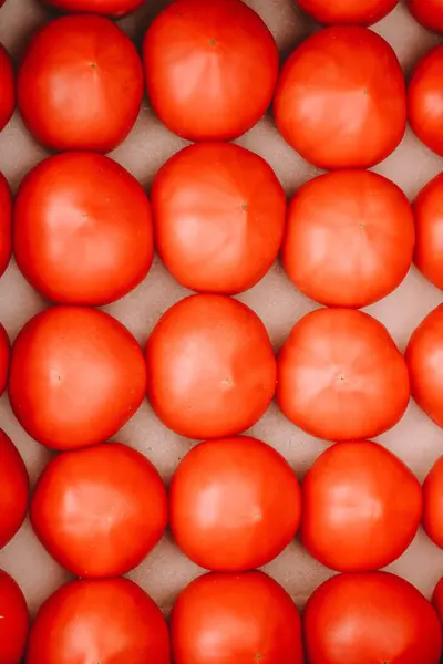 Fresh red tomatoes in the box at the local market. Top view. — Stock Image Fresh red tomatoes in the box at the local market. Top view. Stock Picture