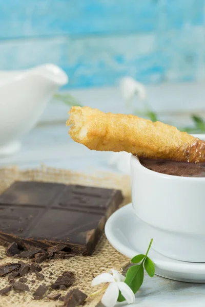 Typical Spanish breakfast, fritter and chocolate