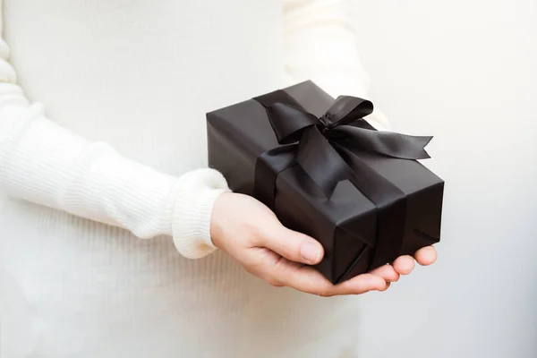 Close Shot Female Hands Holding Small Black Gift Wrapped Black — Stock Photo, Image