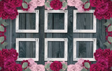 Ahşap arka planda güller ve vintage fotoğraf çerçevesi