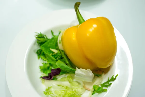 fresh salad on a plate yellow pepper