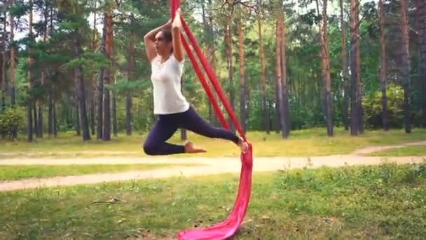 Young Woman Practicing Aerial Yoga Exercise Antigravity Yoga Outdoors Flying — Stock Video