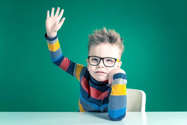 Pretty boy in glasses waving into the camera. Close-up — Stock Photo, Image