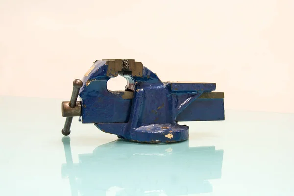 Blue steel vise on table background — Stock Photo, Image