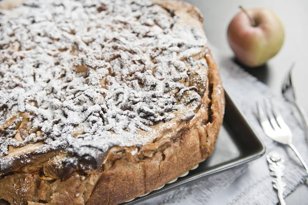 Apple pie, powdered sugar, apple and vintage forks