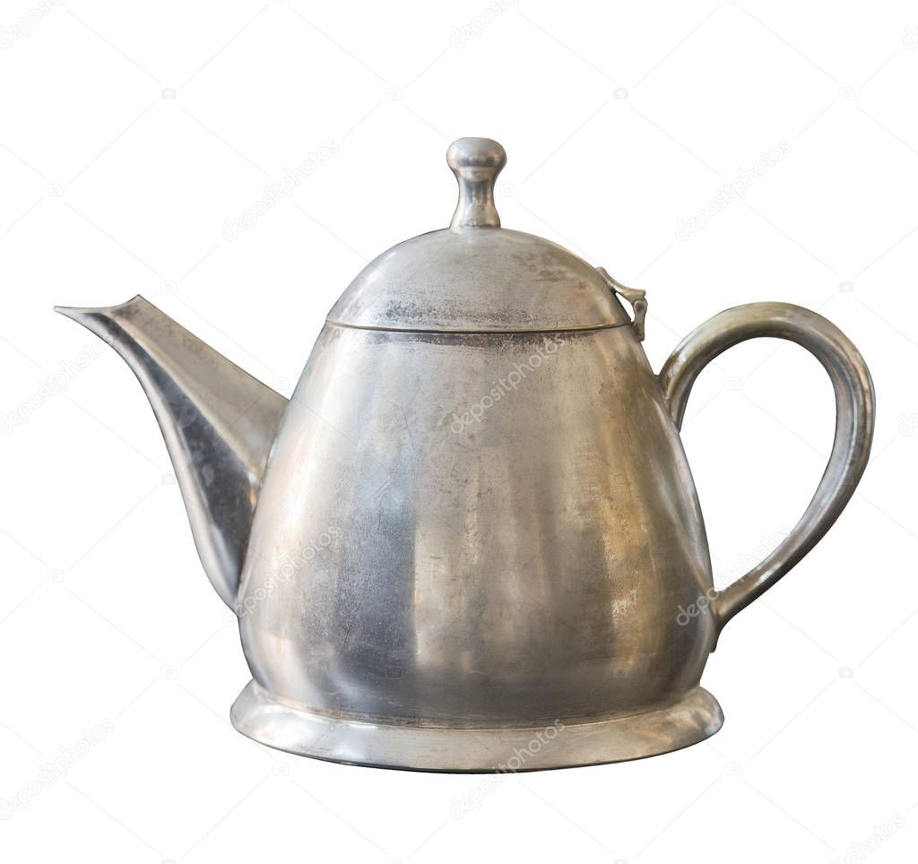 Old metal kettle isolated on white background. Vintage shabby dishes