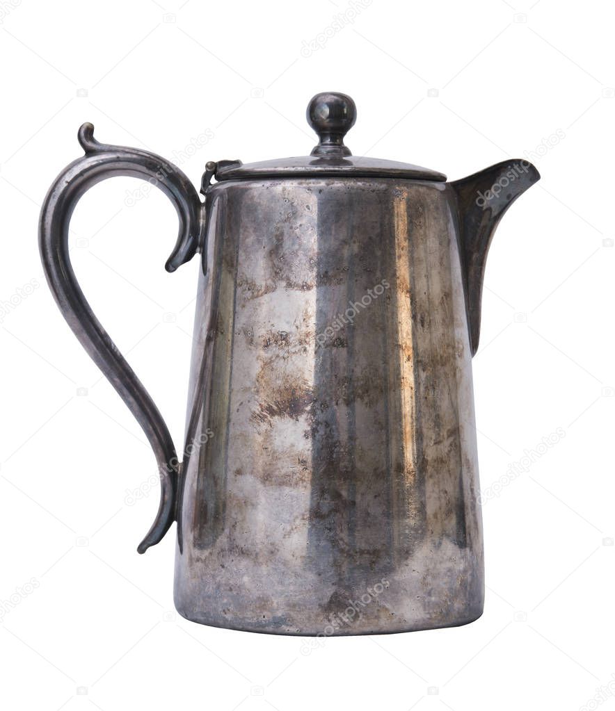 Old aluminum kettle isolated on white background. Vintage shabby dishes
