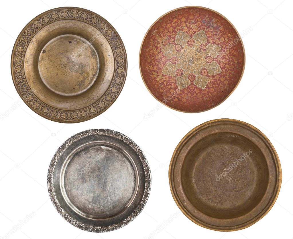 four antique metal painted plates isolated on white background. Retro style. Vintage.